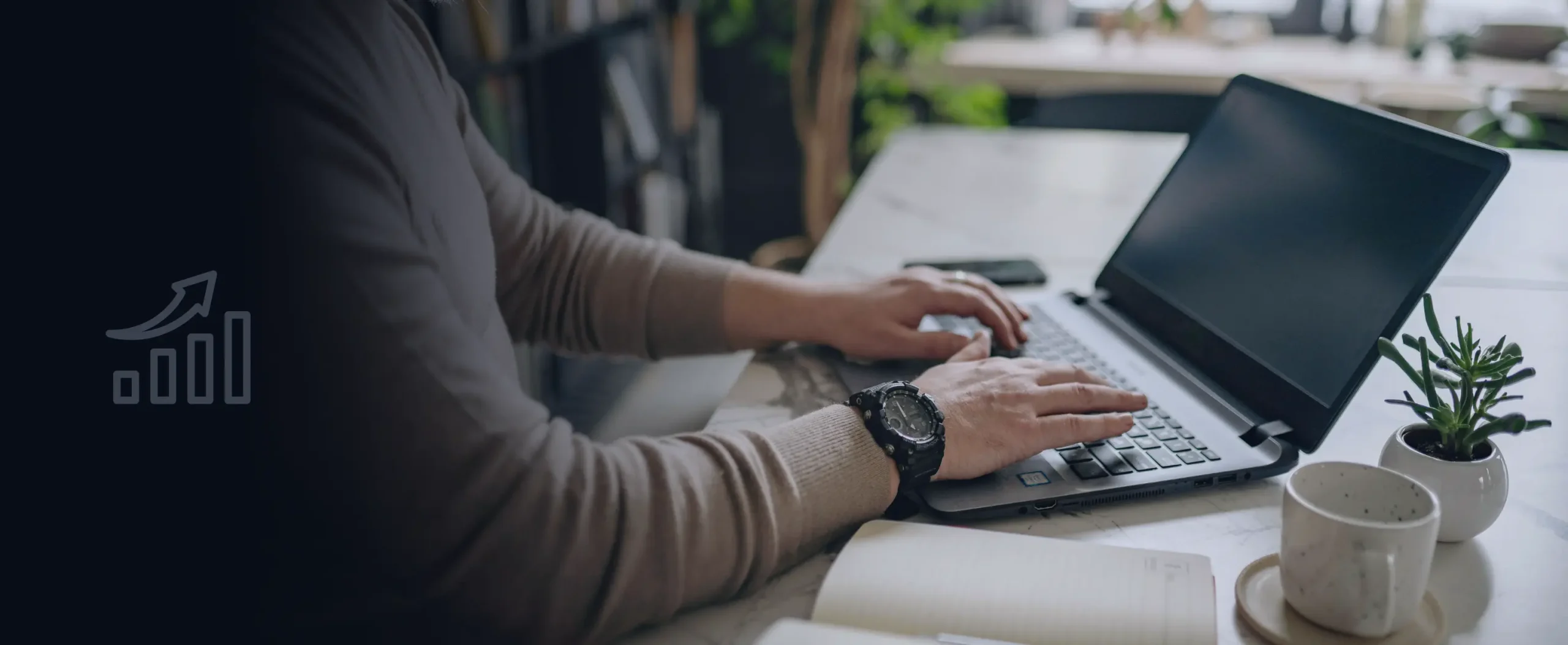 Laptop displaying a WiFi monetization dashboard while a professional works at a desk.